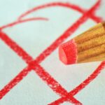 pen, red pen, mark with a cross