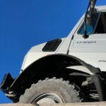 a white truck with a flat tire