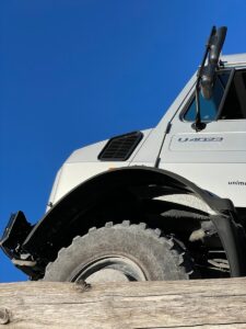 a white truck with a flat tire