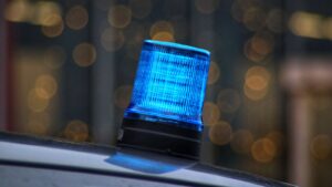 a blue light sitting on top of a car