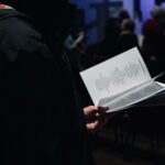 person standing while reading ook