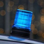 a blue light sitting on top of a car