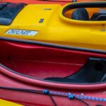 a row of kayaks lined up in a row