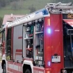 a red fire truck with its doors open