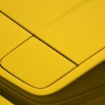 yellow and black plastic container
