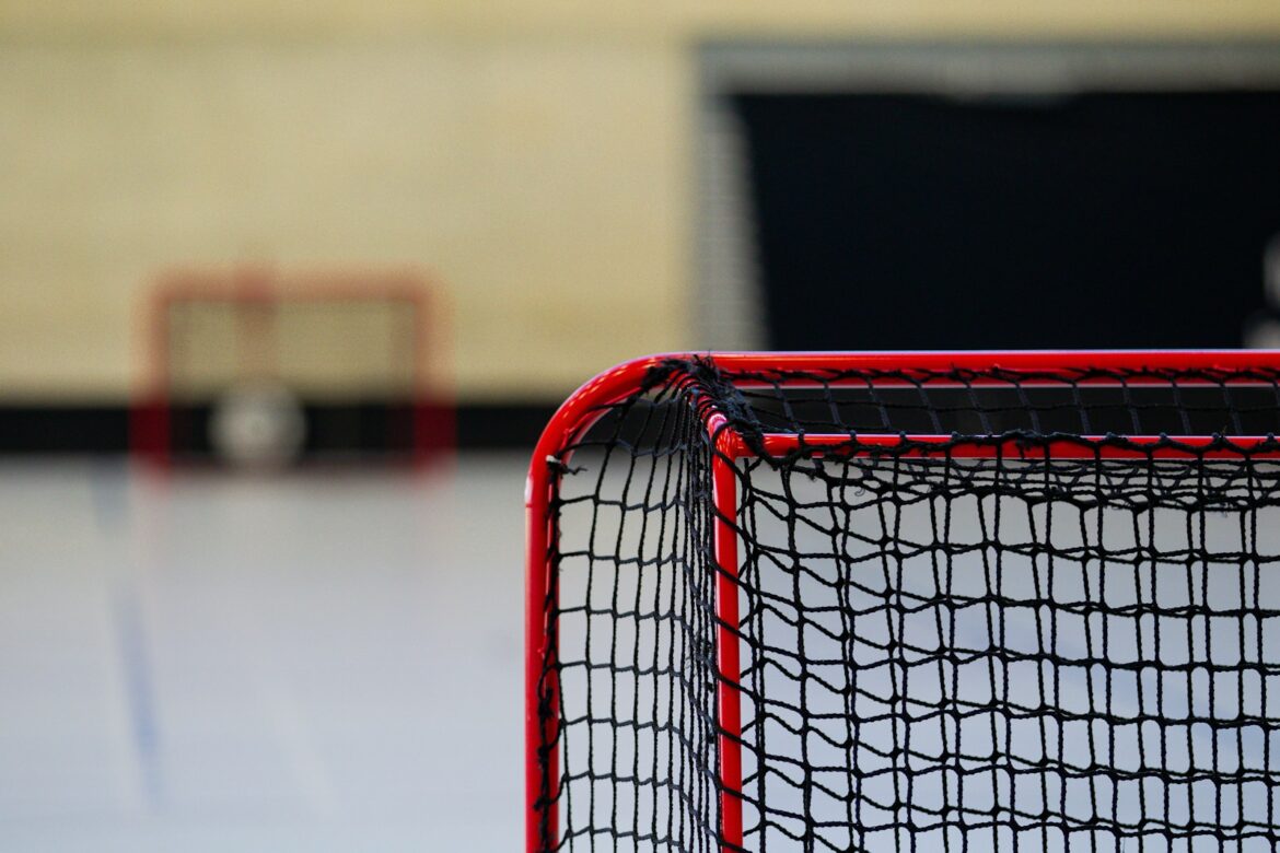 A close up of a tennis net on a court