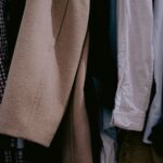 a bunch of clothes hanging on a rack