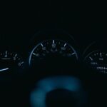 The dashboard of a car in the dark